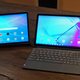 A photo of the Lenovo Yoga Tab 11 and the Lenovo Tab P11 Plus on a wooden table.